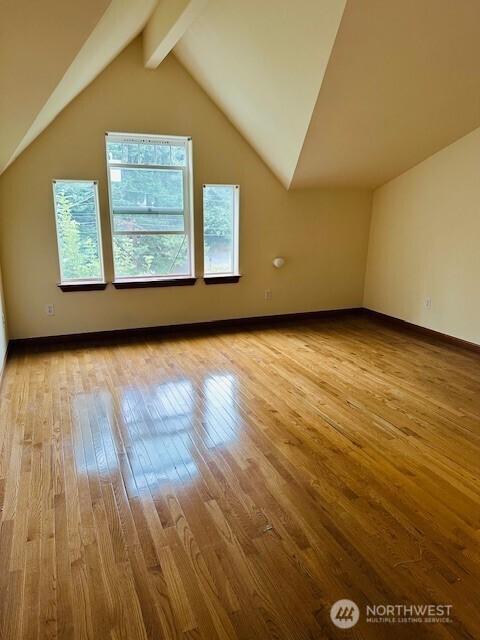 6829 Weedin Pl NE, Seattle, WA 98115 - additional living space featuring hardwood / wood-style flooring and baseboards