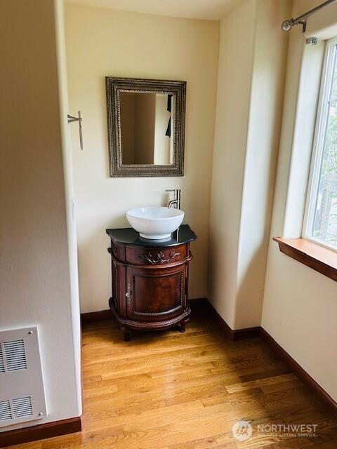 6829 Weedin Pl NE, Seattle, WA 98115 - bathroom featuring vanity and wood finished floors