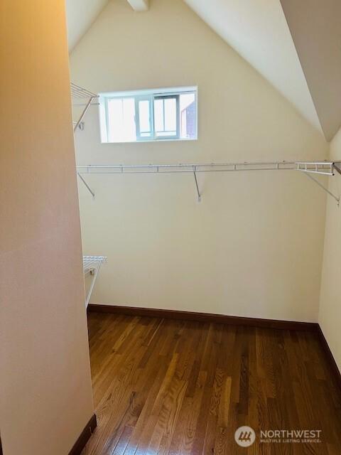 6829 Weedin Pl NE, Seattle, WA 98115 - spacious closet featuring lofted ceiling and dark wood-style flooring