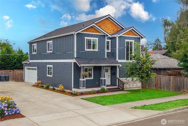 814 9th St SW, Puyallup, WA 98371 - craftsman-style home featuring board and batten siding, a porch, driveway, an attached garage, and roof with shingles