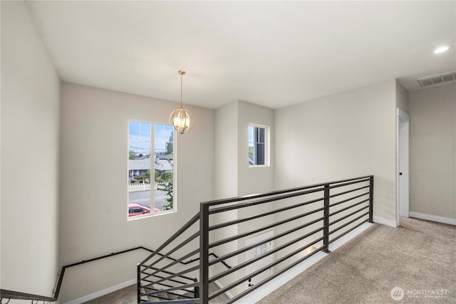 814 9th St SW, Puyallup, WA 98371 - stairway with carpet, plenty of natural light, and a chandelier