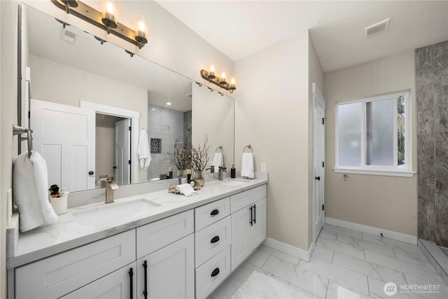 814 9th St SW, Puyallup, WA 98371 - full bathroom featuring marble finish floors, double vanity, and tiled shower