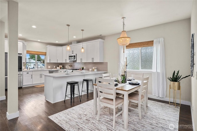 814 9th St SW, Puyallup, WA 98371 - dining space with dark wood-style floors and recessed lighting