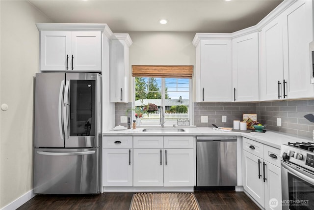 814 9th St SW, Puyallup, WA 98371 - kitchen with stainless steel appliances, light countertops, white cabinetry, and recessed lighting