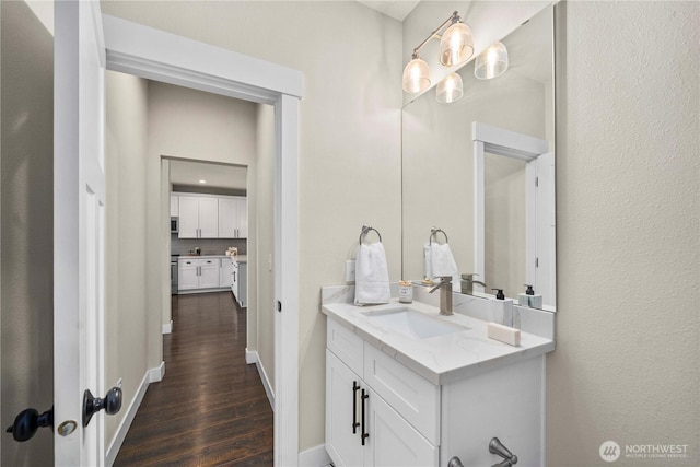 814 9th St SW, Puyallup, WA 98371 - bathroom with wood finished floors and vanity