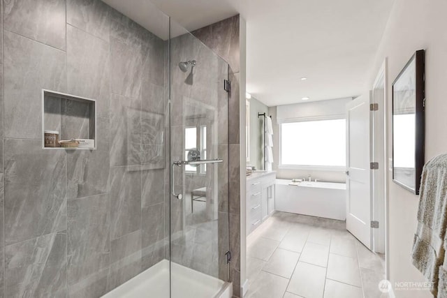 13212 164th Ave SE Unit 207, Renton, WA 98059 - full bath with a stall shower, a garden tub, and tile patterned floors