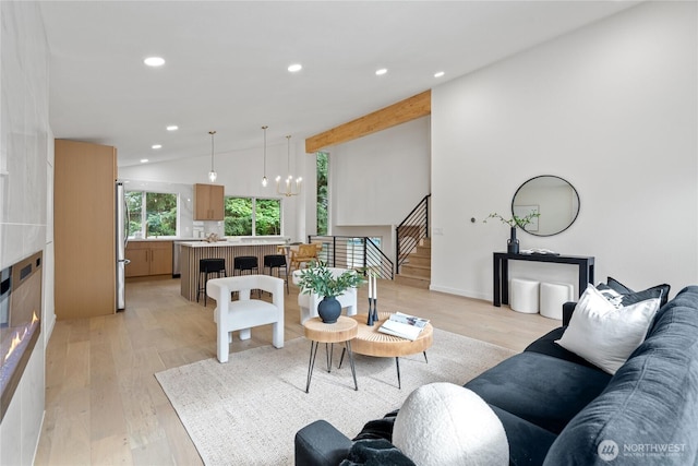 13652 99th Ave NE, Kirkland, WA 98034 - living area with lofted ceiling, light wood-type flooring, a chandelier, recessed lighting, and stairway