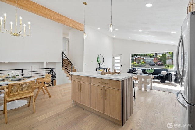 13652 99th Ave NE, Kirkland, WA 98034 - kitchen with vaulted ceiling, freestanding refrigerator, recessed lighting, open floor plan, and light wood-style flooring