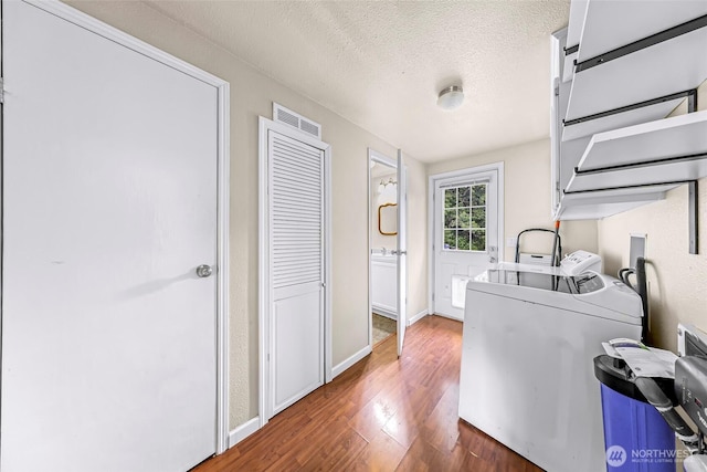 2366 Northshore Rd, Bellingham, WA 98226 - laundry area with washer / dryer, wood finished floors, and a textured ceiling