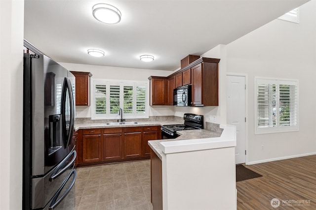 6540 Indiana St SE, Olympia, WA 98513 - kitchen with black appliances, a peninsula, and light countertops