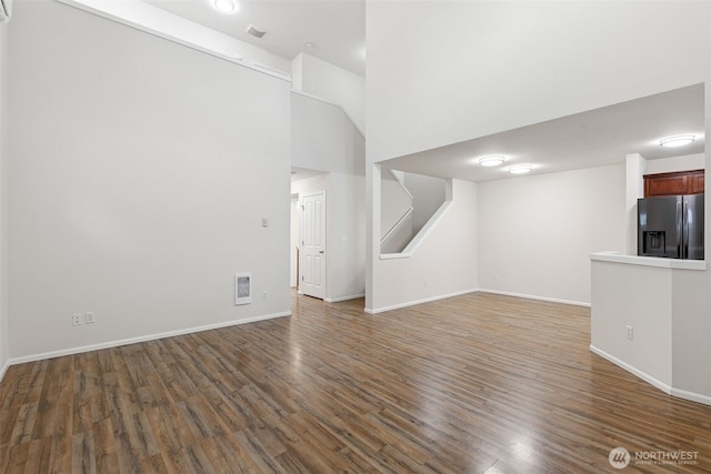 6540 Indiana St SE, Olympia, WA 98513 - unfurnished living room featuring wood finished floors and a high ceiling