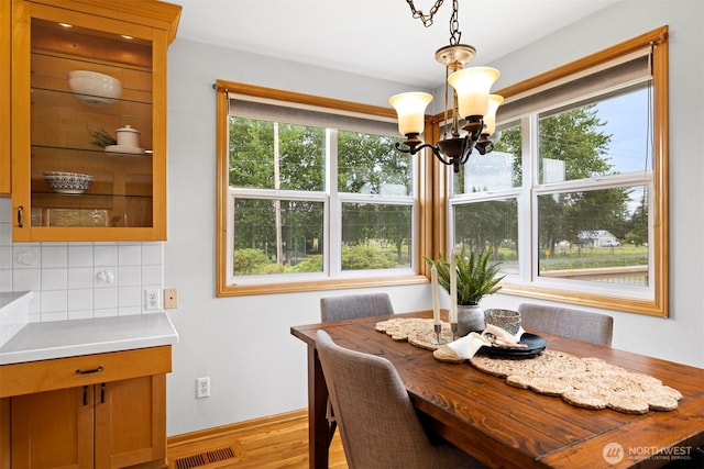 347 W King Tut Rd, Bellingham, WA 98226 - dining space featuring a chandelier, healthy amount of natural light, and light wood-type flooring
