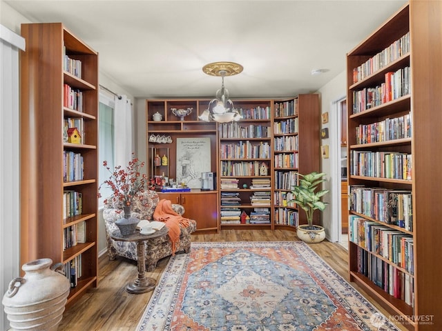 3300 Carpenter Rd SE Unit 49, Lacey, WA 98503 - sitting room featuring bookshelves and wood finished floors