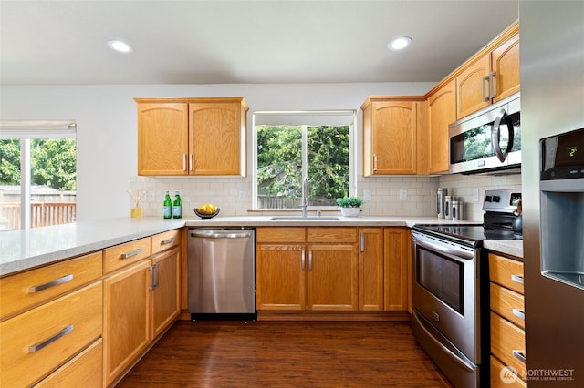 2406 119th St SW Unit D2, Everett, WA 98204 - kitchen featuring appliances with stainless steel finishes, light countertops, backsplash, dark wood finished floors, and recessed lighting