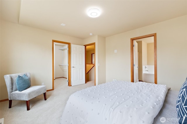 2406 119th St SW Unit D2, Everett, WA 98204 - bedroom with light colored carpet, a walk in closet, and connected bathroom