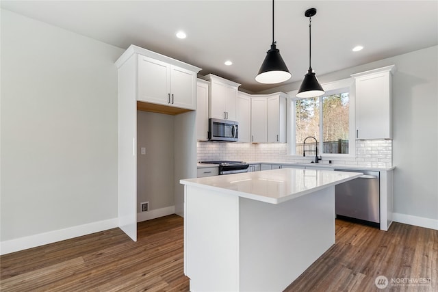 2630LOT12 Sievers Way, Ferndale, WA 98248 - kitchen featuring stainless steel appliances, backsplash, dark wood-type flooring, white cabinetry, and recessed lighting