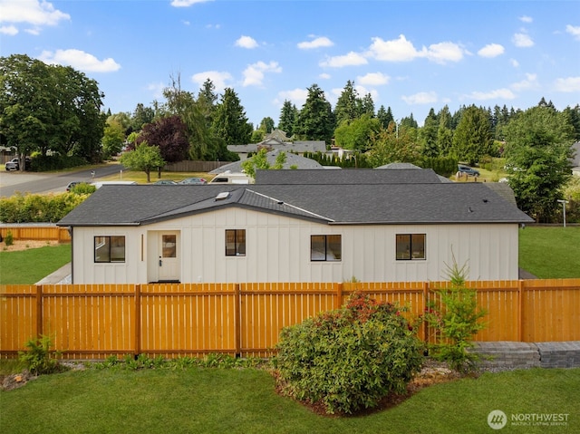 7605 20th Ave E, Tacoma, WA 98404 - view of side of home featuring roof with shingles