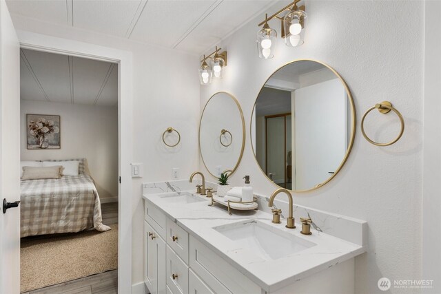 7605 20th Ave E, Tacoma, WA 98404 - full bathroom featuring ensuite bath, double vanity, and wood finished floors