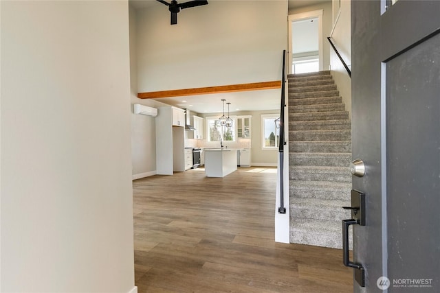 2632LOT13 Sievers Way, Ferndale, WA 98248 - foyer entrance featuring stairway, wood finished floors, a towering ceiling, and ceiling fan