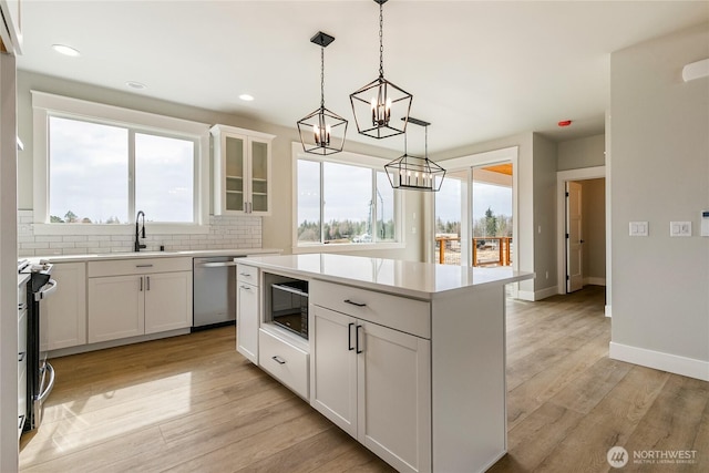 2632LOT13 Sievers Way, Ferndale, WA 98248 - kitchen featuring stainless steel appliances, plenty of natural light, a kitchen island, light countertops, and recessed lighting