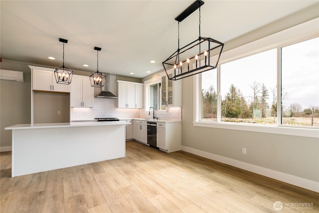2632LOT13 Sievers Way, Ferndale, WA 98248 - kitchen featuring wall chimney exhaust hood, a wall unit AC, a chandelier, white cabinetry, and recessed lighting