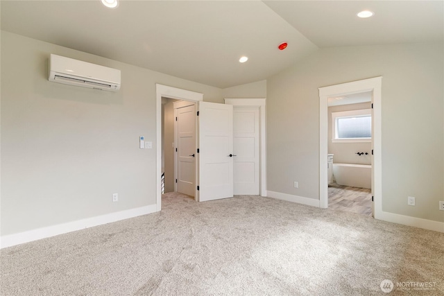 2632LOT13 Sievers Way, Ferndale, WA 98248 - unfurnished bedroom with a wall unit AC, carpet, vaulted ceiling, recessed lighting, and ensuite bath