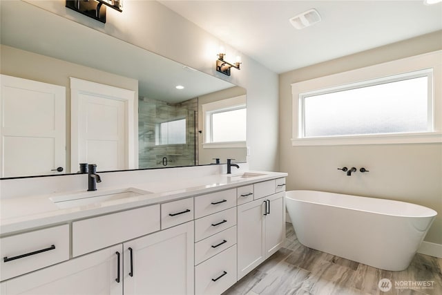 2632LOT13 Sievers Way, Ferndale, WA 98248 - bathroom featuring a shower stall, double vanity, and a freestanding tub