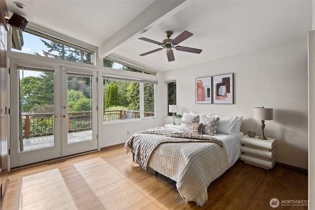 3015 44th Ave W, Seattle, WA 98199 - bedroom with multiple windows, french doors, access to exterior, and wood finished floors