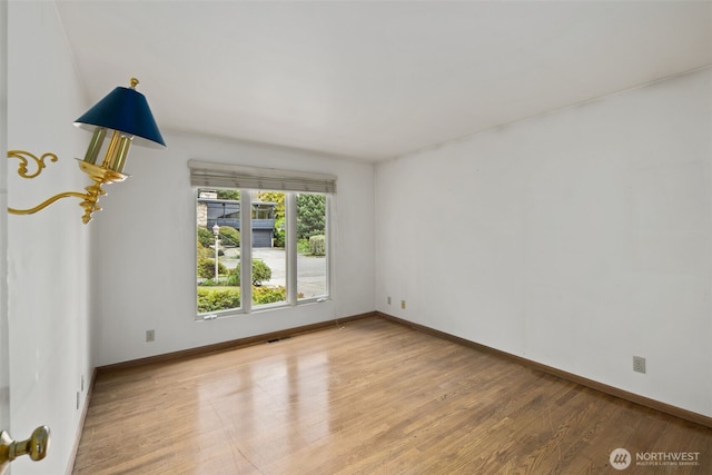 3015 44th Ave W, Seattle, WA 98199 - spare room featuring light wood-type flooring and baseboards