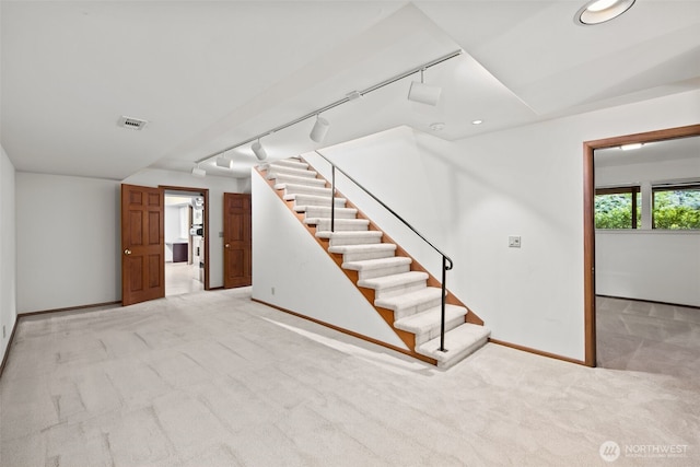 3015 44th Ave W, Seattle, WA 98199 - below grade area with carpet flooring, stairs, rail lighting, and recessed lighting