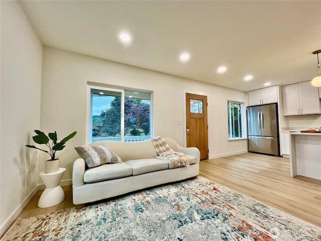 746 N 88th St, Seattle, WA 98103 - living area featuring light wood-type flooring and recessed lighting