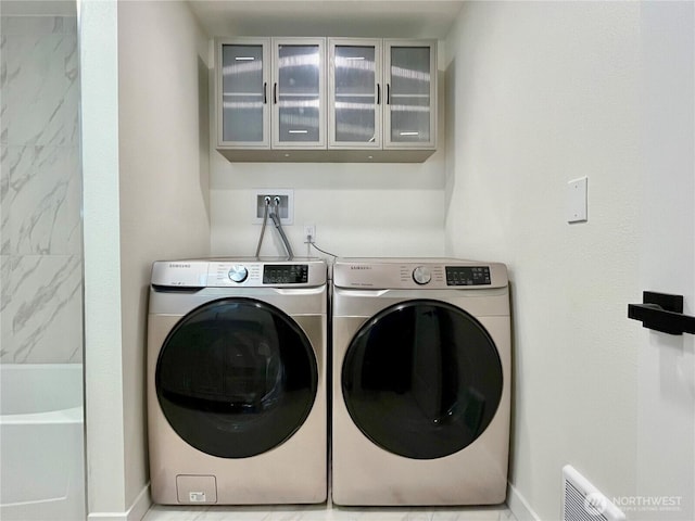 746 N 88th St, Seattle, WA 98103 - laundry area with washer and dryer and baseboards