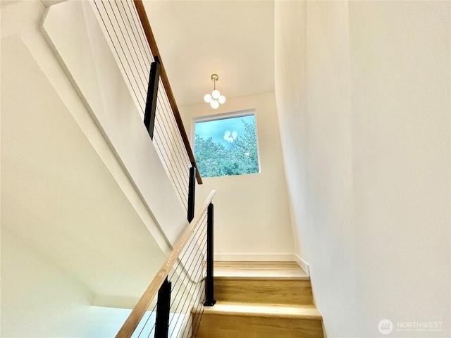 746 N 88th St, Seattle, WA 98103 - stairway with baseboards and wood finished floors