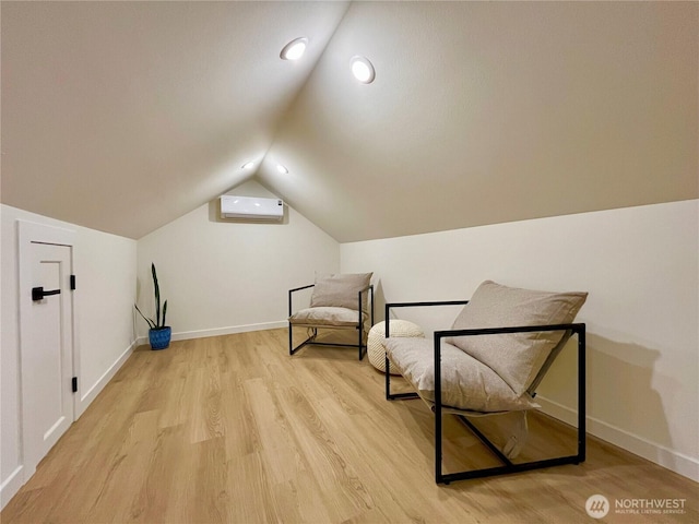 746 N 88th St, Seattle, WA 98103 - unfurnished room featuring a wall mounted air conditioner, light wood-type flooring, vaulted ceiling, and recessed lighting