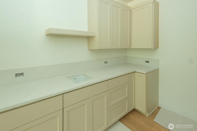 12107 Mundy Loss Rd E, Buckley, WA 98321 - kitchen featuring light wood-style floors and light countertops