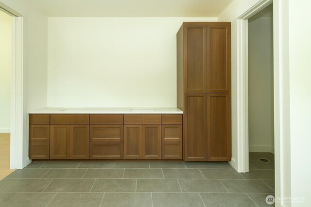 12107 Mundy Loss Rd E, Buckley, WA 98321 - hall featuring light tile patterned flooring and baseboards