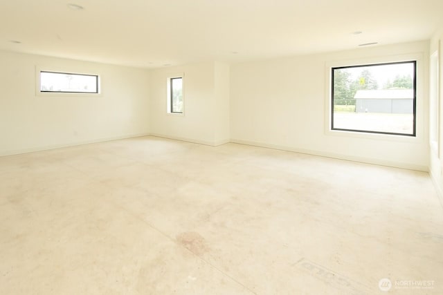 12107 Mundy Loss Rd E, Buckley, WA 98321 - empty room with baseboards and concrete flooring
