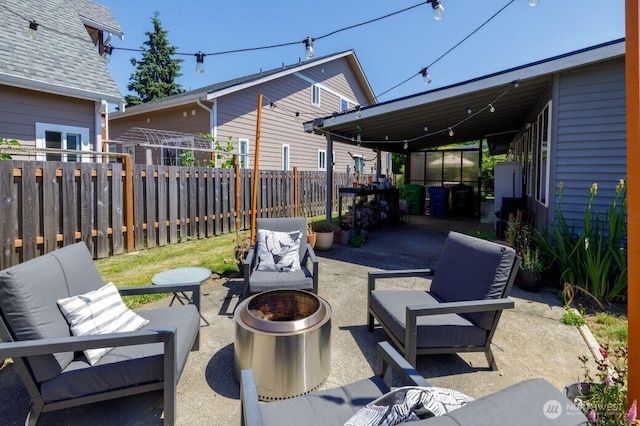 133 Thomas St NW, Olympia, WA 98502 - fenced backyard with a patio area and an outdoor living space with a fire pit