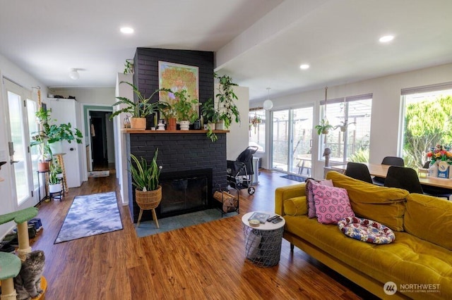 133 Thomas St NW, Olympia, WA 98502 - living area with a brick fireplace, wood finished floors, and recessed lighting