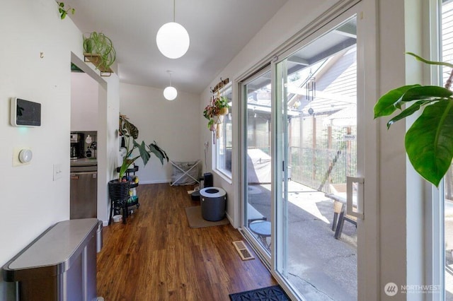 133 Thomas St NW, Olympia, WA 98502 - doorway with dark wood-type flooring and baseboards