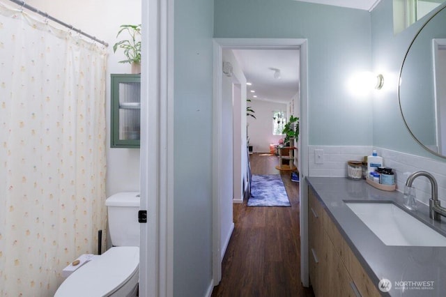 133 Thomas St NW, Olympia, WA 98502 - bathroom featuring wood finished floors, vanity, and a shower with shower curtain