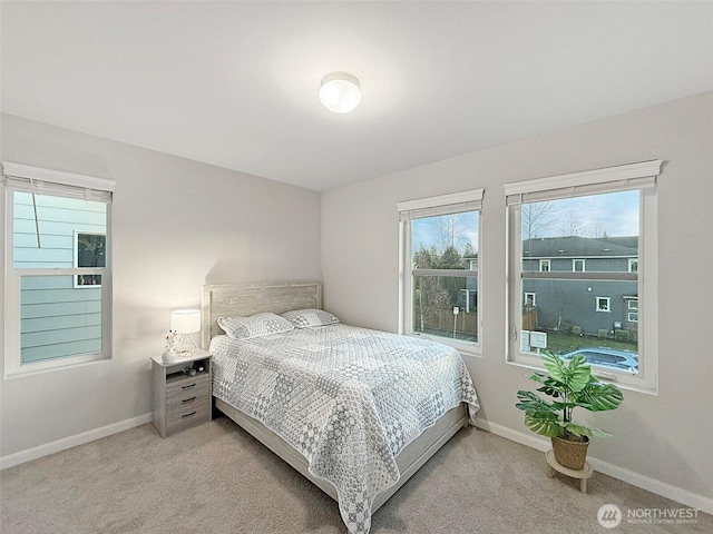 12102 SE 314th Pl, Auburn, WA 98092 - bedroom featuring light colored carpet and baseboards