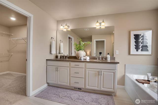 4418 233rd Pl SE, Bothell, WA 98021 - full bath featuring double vanity, a bath, and a spacious closet