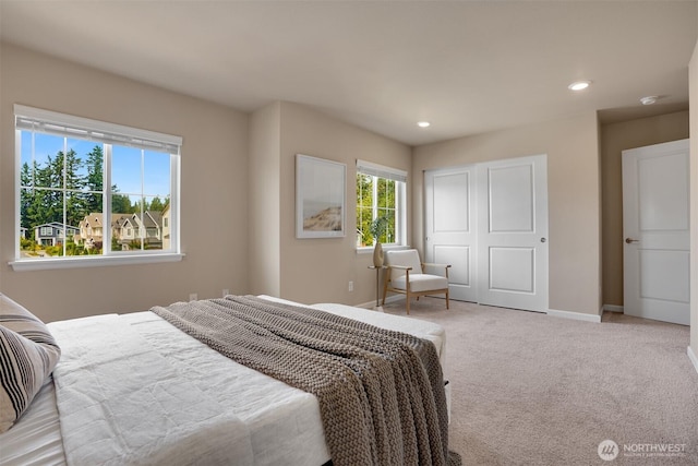 4418 233rd Pl SE, Bothell, WA 98021 - bedroom with light colored carpet, recessed lighting, multiple windows, and a closet