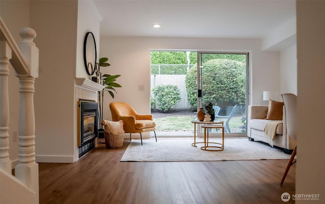 315E Park St Unit A22, North Bend, WA 98045 - living area with a tile fireplace, wood finished floors, and recessed lighting