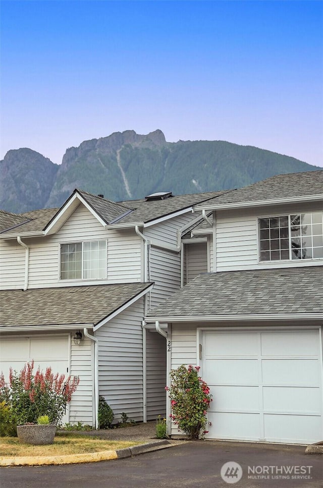 315E Park St Unit A22, North Bend, WA 98045 - view of front of home with a mountain view and an attached garage