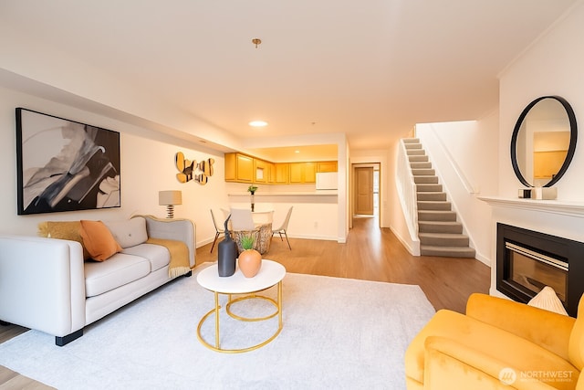 315E Park St Unit A22, North Bend, WA 98045 - living area featuring light wood-style flooring, stairs, recessed lighting, and a glass covered fireplace
