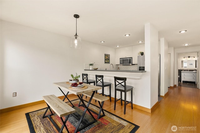 500 Aloha St Unit 202, Seattle, WA 98109 - dining room featuring light wood-type flooring and recessed lighting