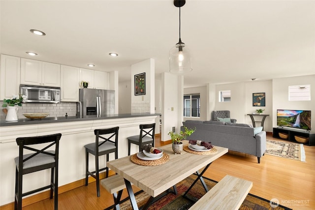 500 Aloha St Unit 202, Seattle, WA 98109 - dining area featuring light wood-type flooring and recessed lighting