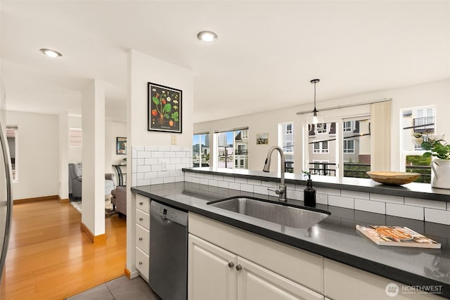 500 Aloha St Unit 202, Seattle, WA 98109 - kitchen featuring dishwasher, dark countertops, plenty of natural light, white cabinetry, and recessed lighting